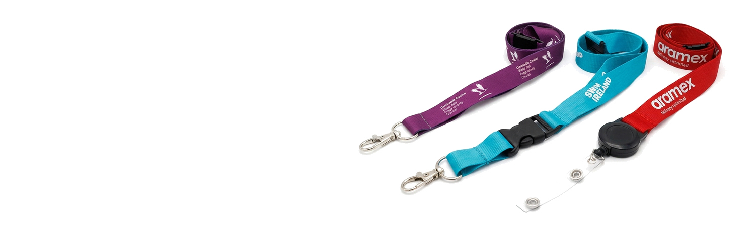 Purple, turquoise and red branded lanyards with clips, safety buckles and a retractable badge reel